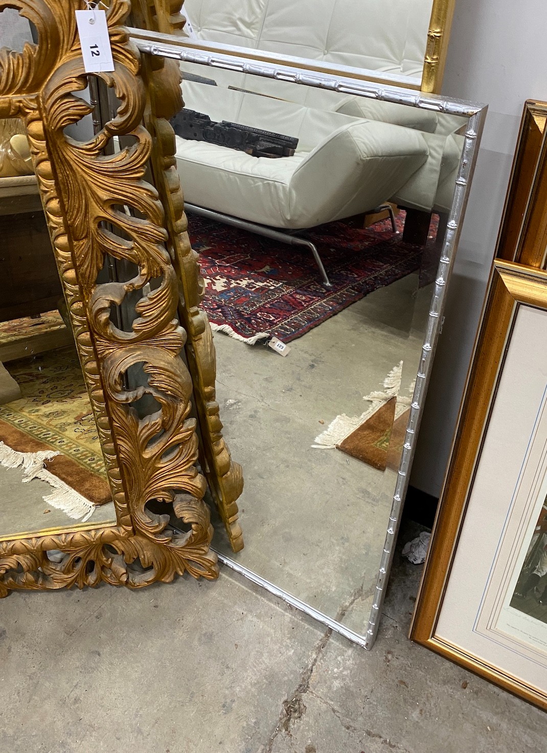 Three composition wall mirrors, largest 110 x 80cm